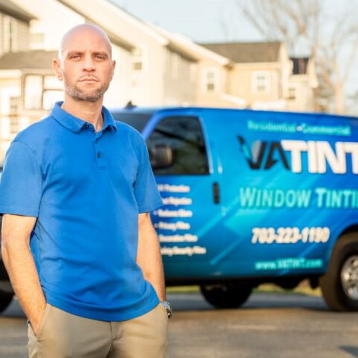 Man standing next to VA Tint commercial van